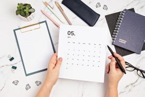 desktop-with-calendar-for-may-and-office-supplies-2021-08-31-00-30-44-utc
